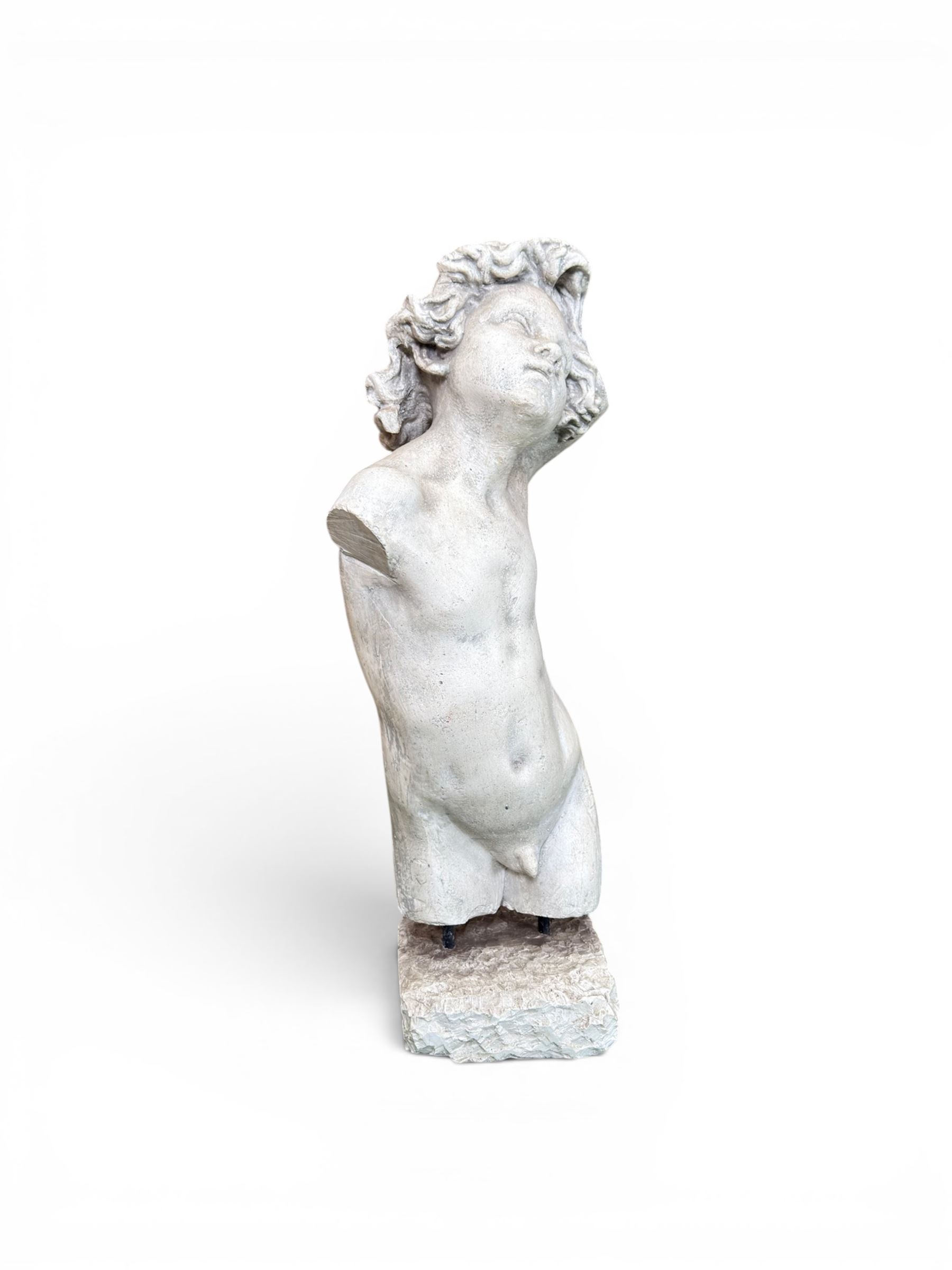 Early 20th century sculptured painted plaster figure of a boys torso, raised on 'stone' plinth