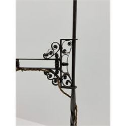 Wrought metal standard lamp, single cantilever adjustable branch on twist column with finial, out splayed supports with scroll terminals, H130cm