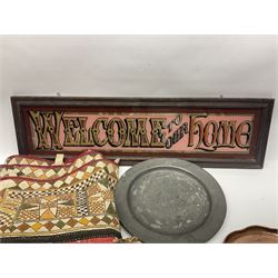 Mirrored Welcome to our Home sign in wooden frame, together with a collection of horse brasses, a tapestry and other metal ware