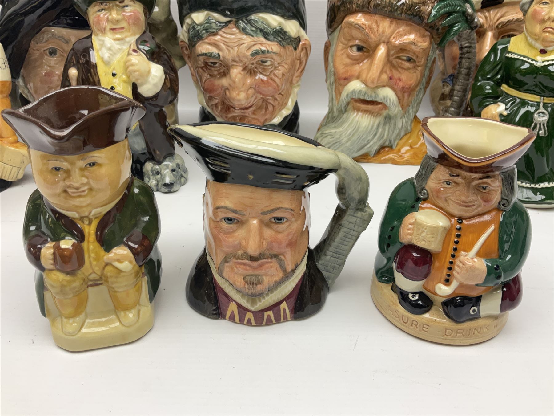 Large collection of Royal Doulton character jugs, to include Robinson Crusoe D6532, Tam O Shanter D6632, The Falconer D6533 etc, together with similar charater jugs and toby jugs   