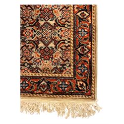 Persian-style wool rug, cream field with floral and geometric motifs, wide floral border (74cm x 142cm); Persian wool rug, beige field with dense floral patterns, narrow floral border (70cm x 144cm); Tribal wool rug, red and navy with diamond motifs (96cm x 60cm); Persian pictorial wool rug, black field with vase, birds, and floral border (70cm x 73cm)