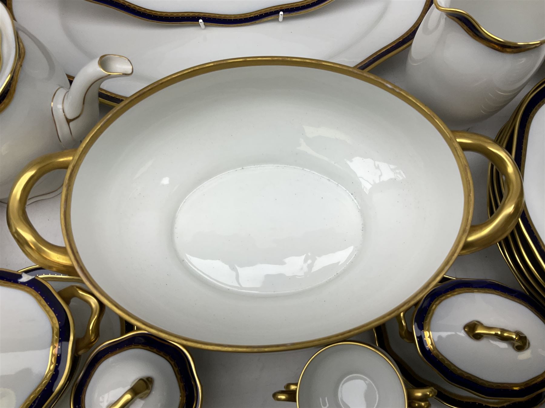 Pirkenhammer of Czechoslovakia Carlsbad pattern tea and dinner for twelve place settings to include dinner plates, soup bowls, side plates, covered tureen, tea cups and saucers, coffee cups and saucers, teapot, milk jug, covered surier, etc, with an addition twelve dinner plates (110)