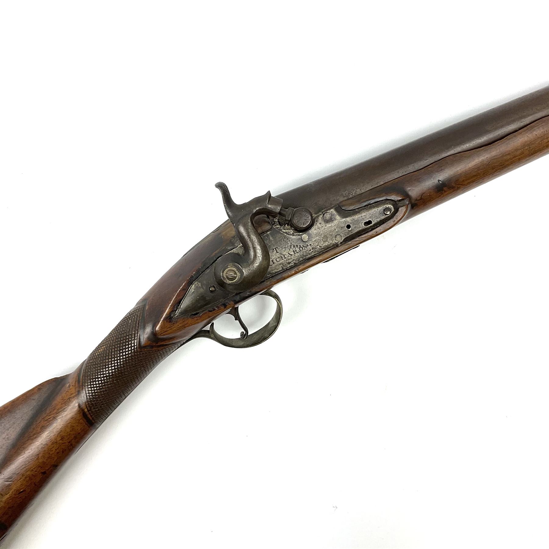 Early 19th century 15-bore flintlock converted to percussion cap fowling piece, the lock stamped T. Richards, walnut half stock with brass fittings including trigger guard with pineapple finial and 91cm barrel with ramrod under L129cm overall