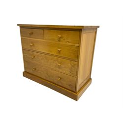 Craftsman made light oak chest, fitted with two short and three long drawers, on plinth base
