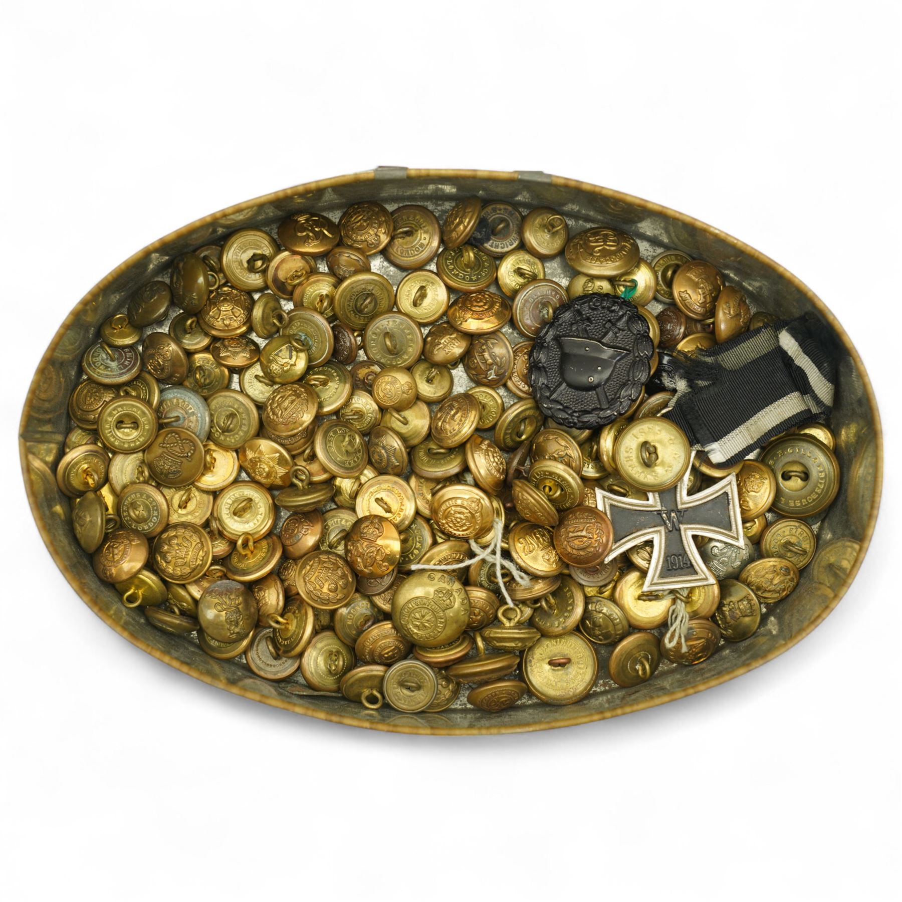 German WWI Iron Cross, black grade wound badge and a quantity of brass military buttons