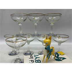 Breweriana; Eight Babycham glasses together with a Babycham plastic fawn mascot and linen I'd Love a Babycham tea towel