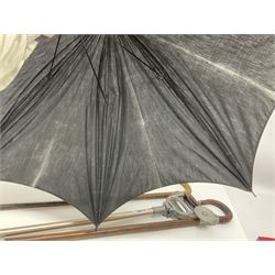 Early 20th century curved horn handle walking stick with hallmarked silver mounts, engraved L Russell 1918, together with a shooting stick by William Mills Birmingham, with leather handle, 'The Featherwaite' shooting stick and an umbrella with wooden handle