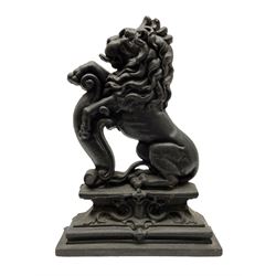 Victorian cast iron door stop, in the form of a rampant lion on elaborate stepped plinth base, H38cm