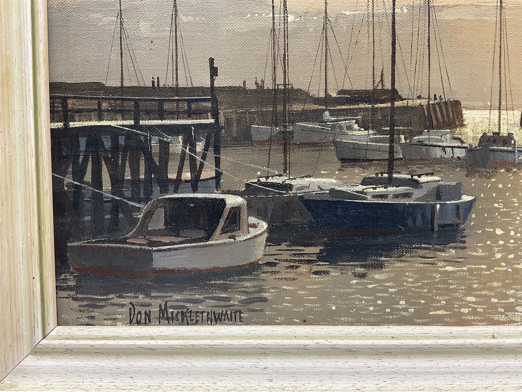 Don Micklethwaite (British 1936-): Scarborough Harbour at Sunset, oil on canvas board signed 34cm x 49cm

