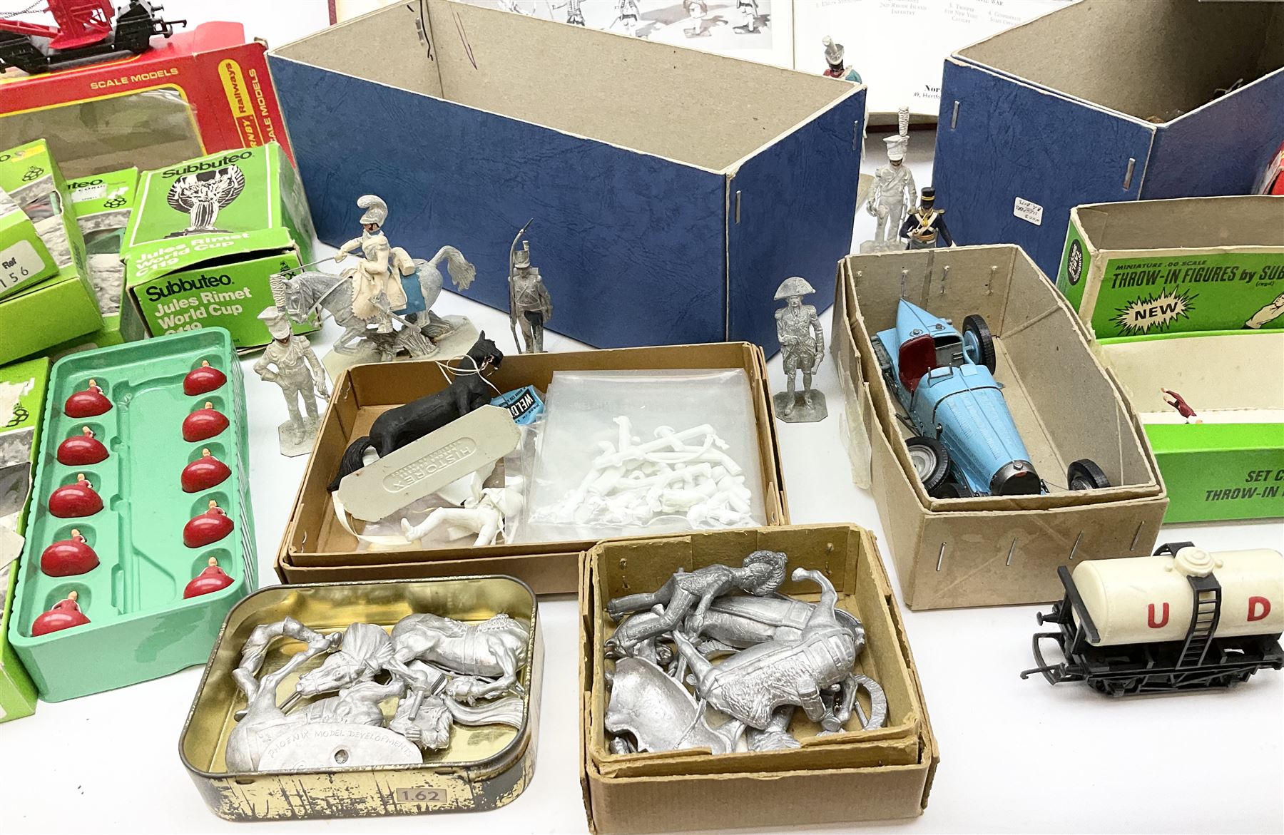 Fifty modern lead figures of mounted and foot soldiers, various period uniforms from 18th century to WW2, painted and unfinished with related paperwork; small quantity of Hornby '00' gauge model railway items and track; and four boxed Subbuteo teams etc