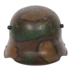WWI German camouflage M16 helmet, with camouflage painted finish to the skull in green, br...