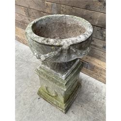 Cast stone centerpiece urn on plinth