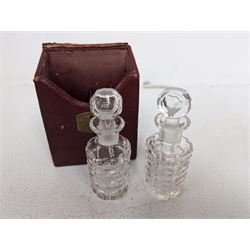 Silver plated faceted glass double ended scent bottle, together with a pair of cut glass scent bottles, in tooled leather case inscribed 'Perfume', scent bottle L11cm