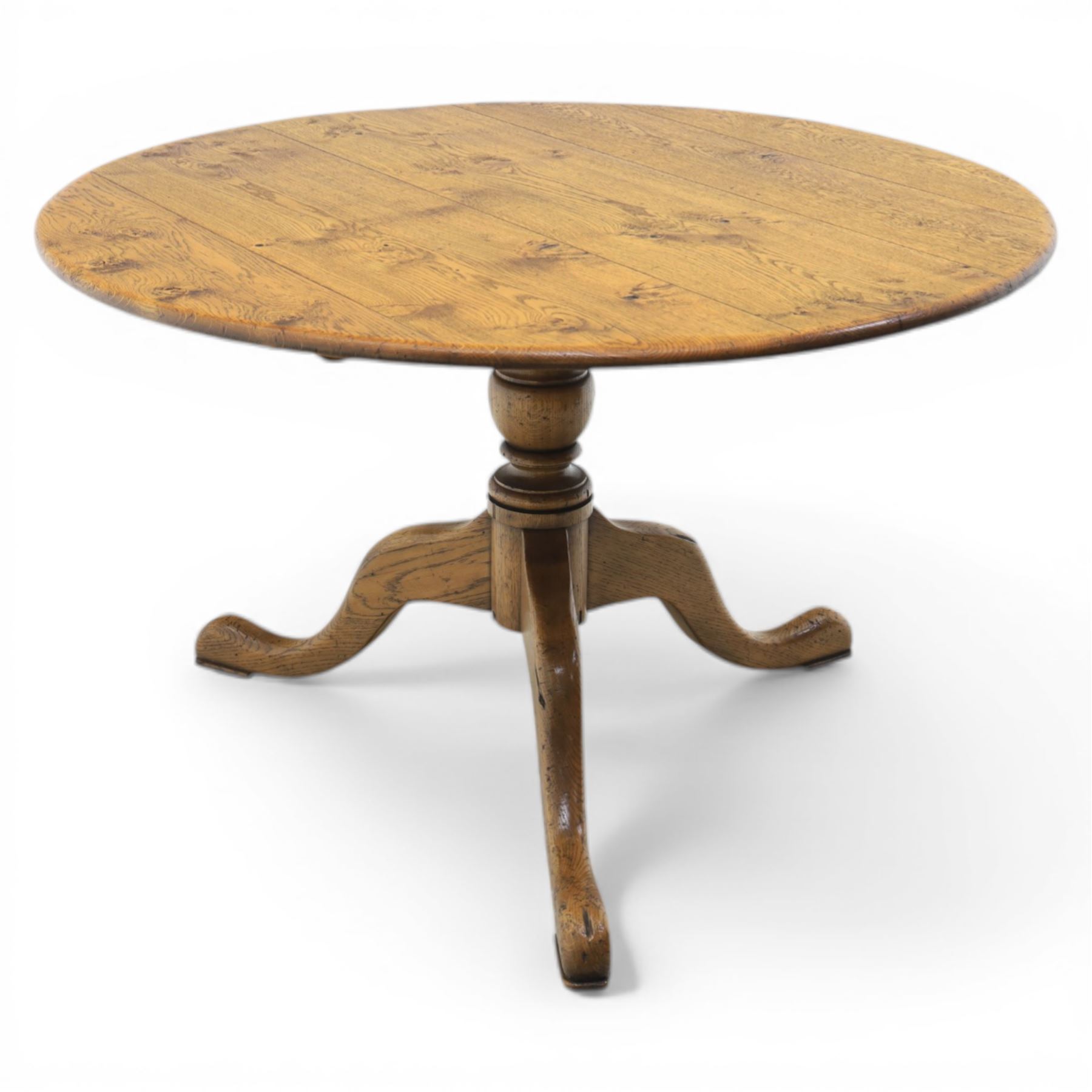 Traditional oak circular pedestal dining table, circular plank top, turned baluster column above three shaped legs