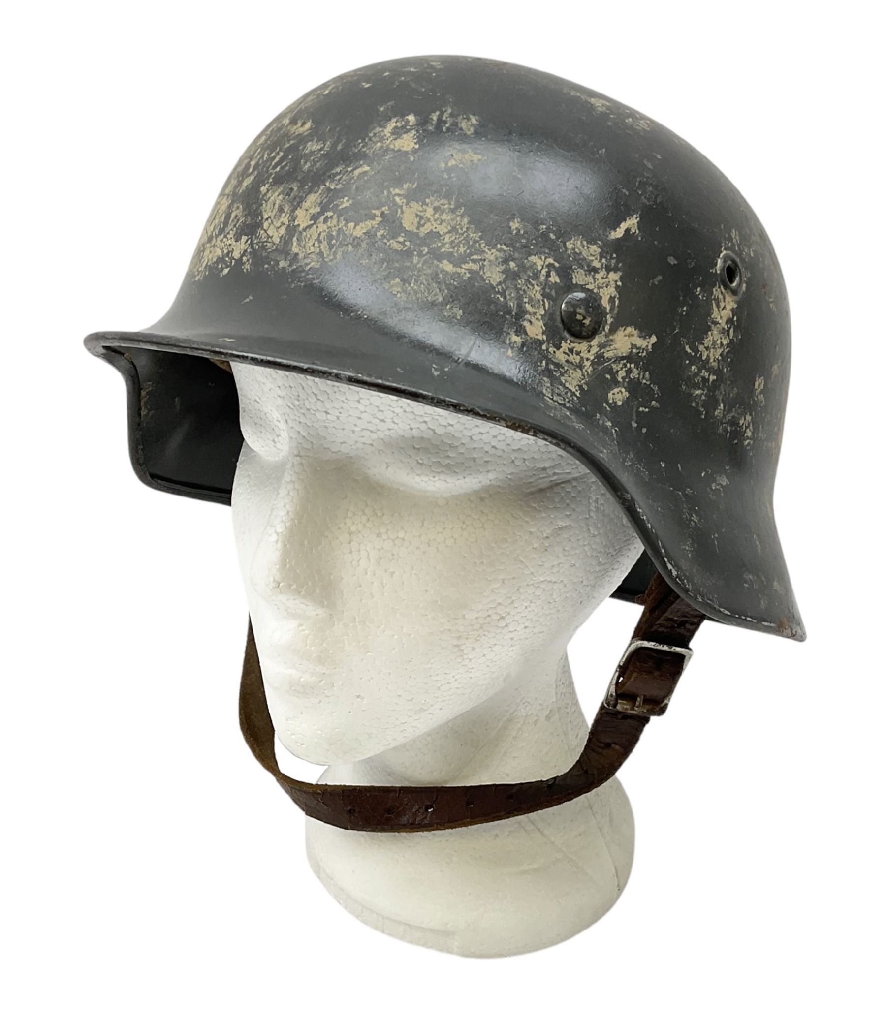 WW2 German steel helmet painted in undecaled Luftwaffe bluey grey with leather liner and chin strap stamped '58', the skirt impressed '1250'