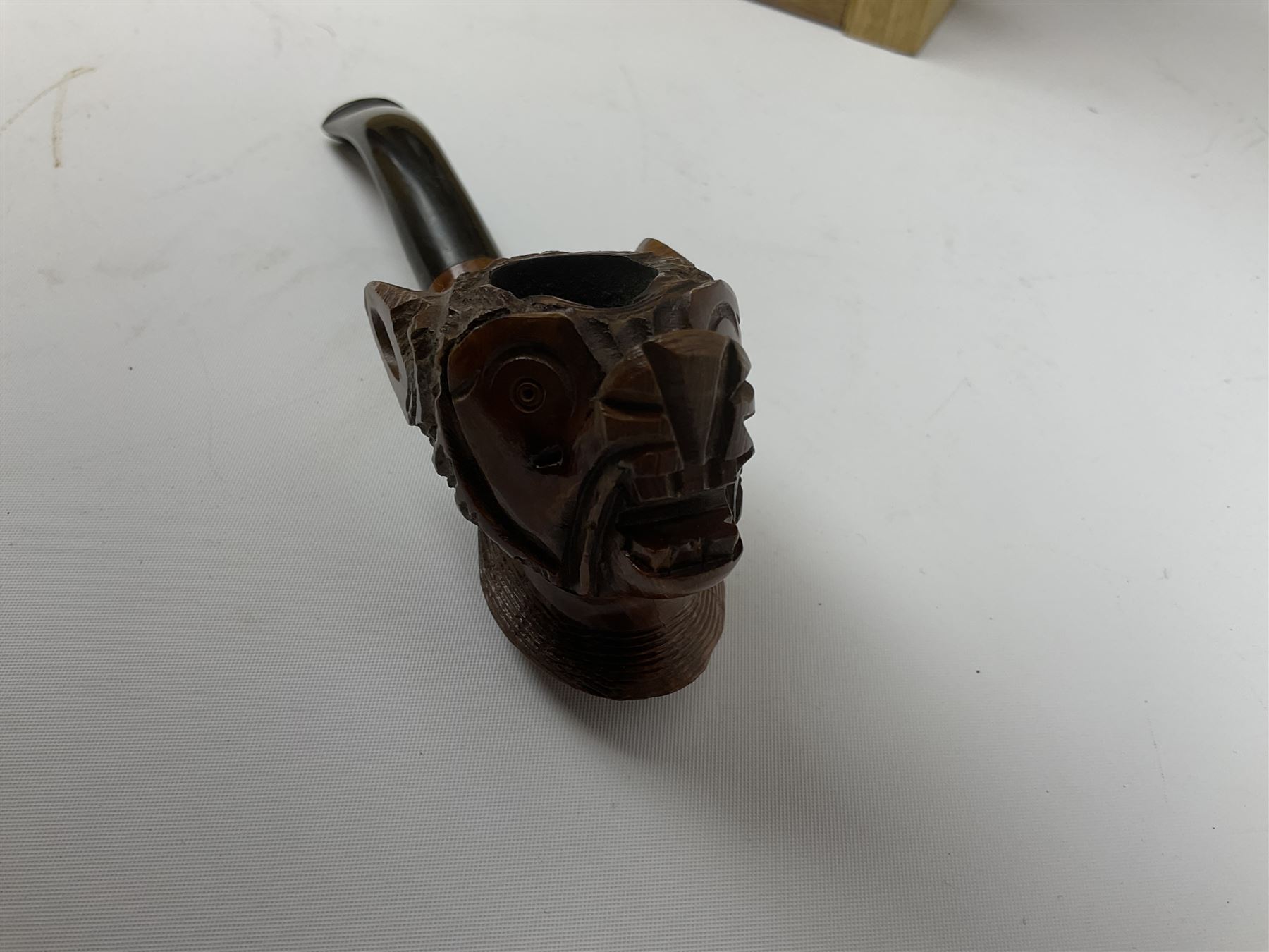 Pipes and two tiered wooden rack together with eleven pipers, including briar pipe carved as a wolf, Sea Dog straight pipe, John Brumfit pipe, meerschaum pipe ect, pipe rack H29.5cm