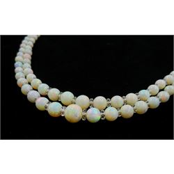 Double strand opal bead and glass bead necklace, graduating opals between 3.5mm to 9mm, on 18ct white gold old cut diamond milgrain set clasp, retailed by Z Barraclough & Sons Ltd, Leeds boxed

Notes: By direct decent from Barraclough family
