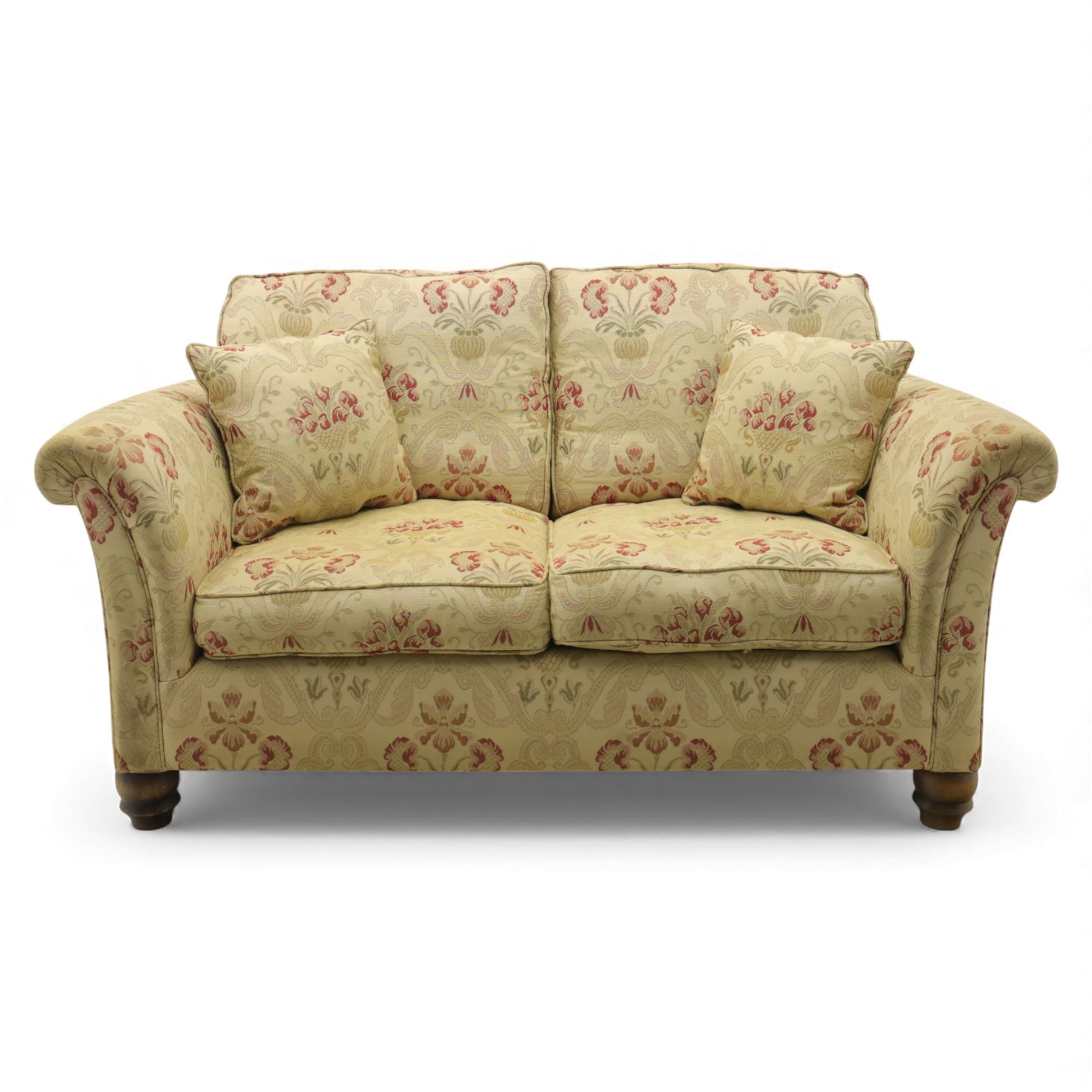 Late 20th century two seat sofa upholstered in floral beige and red fabric, turned supports 
