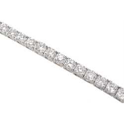 White gold round brilliant cut diamond line bracelet, stamped 18K, total diamond weight approx 3.20 carat