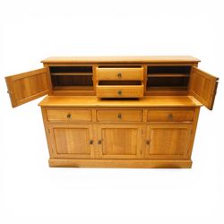 Knightman - Yorkshire oak dresser, the upper section fitted with two drawers flanked by two hutch cupboards, rectangular top over three drawers and fielded panelled cupboard, on skirted base, carved with knight signature, by Horcace Knight of Thirsk