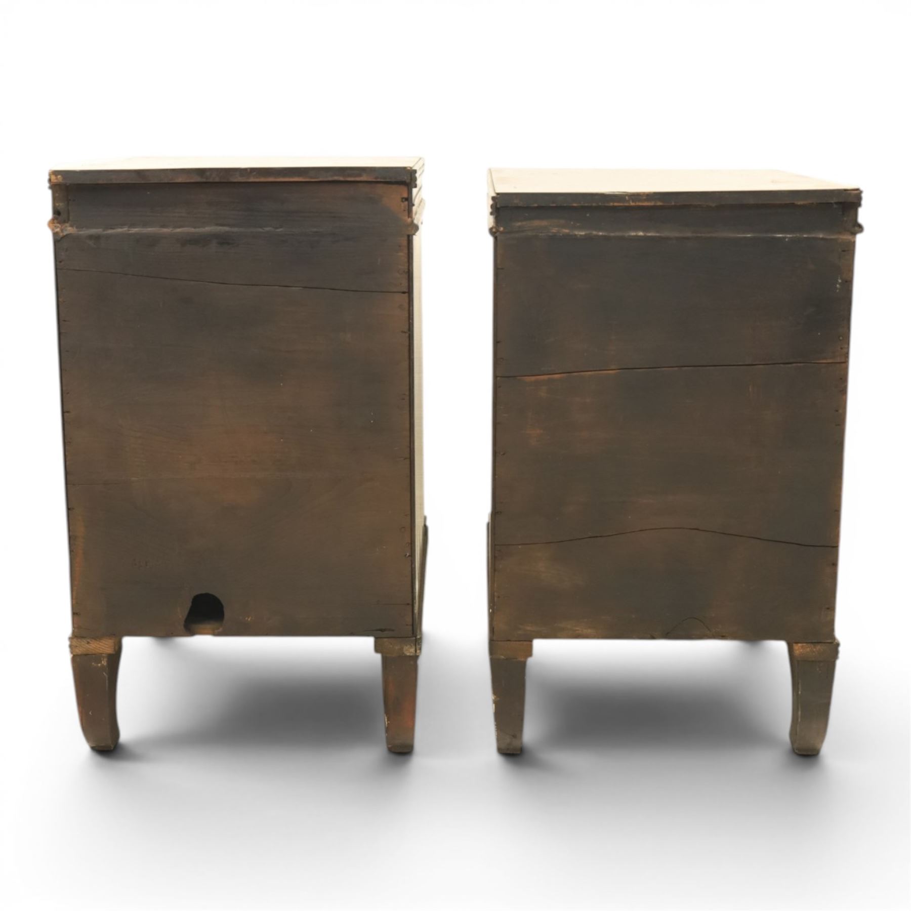  Pair of Regency mahogany bedside cabinets, rectangular top above a central cupboard door with flame mahogany veneer, flanked by spirally turned column uprights, raised on shaped supports