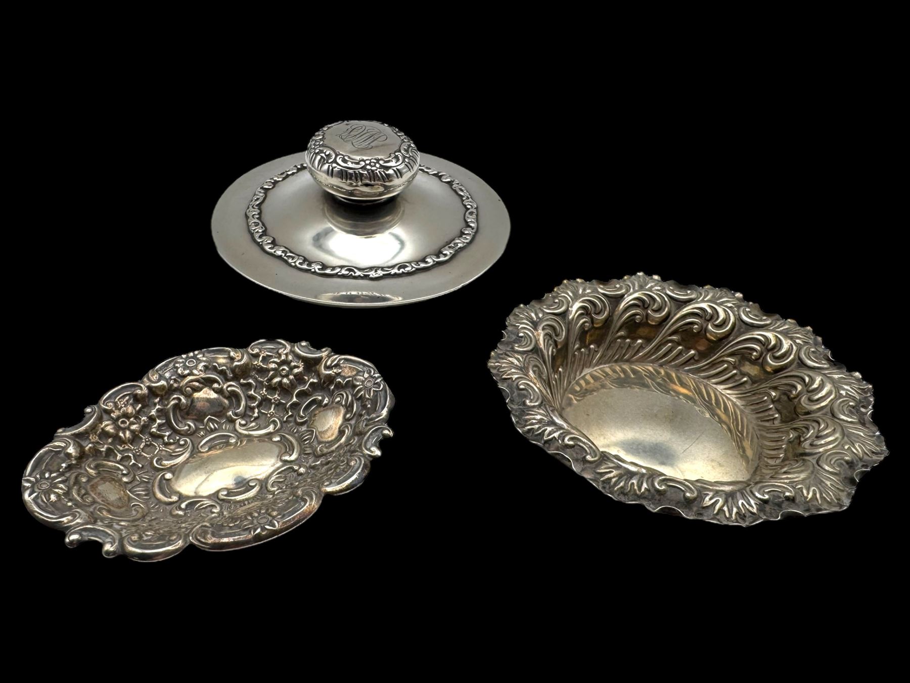 Two silver bon bon dishes, comprising Edwardian example and a modern example, both with embossed decoration, both hallmarked, together with an American silver cover, stamped Sterling