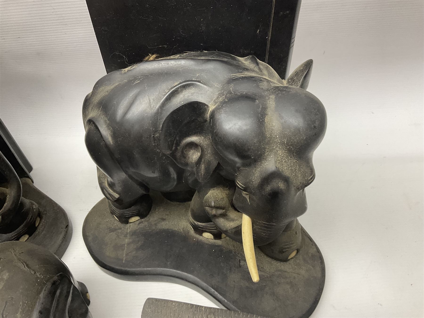 Three pairs of carved wooden elephant bookends, and a similar carved wooden elephant figure, tallest H24cm