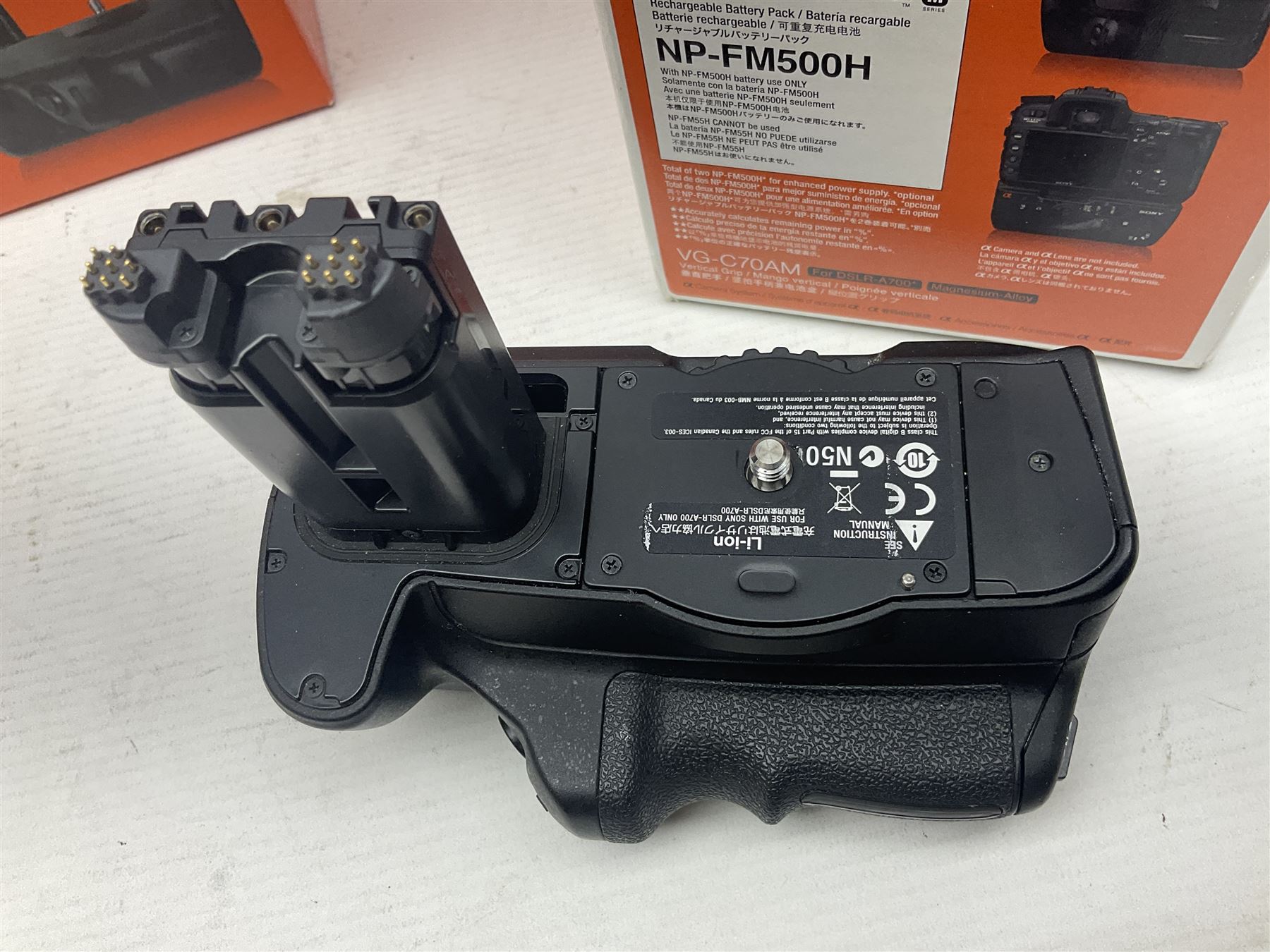 Sony Alpha A700 camera body, serial no 2340937, Sony Alpha A77 camera body, serial no 0715406, together with Sony angle finder and two firm holding grips, all with original boxes  