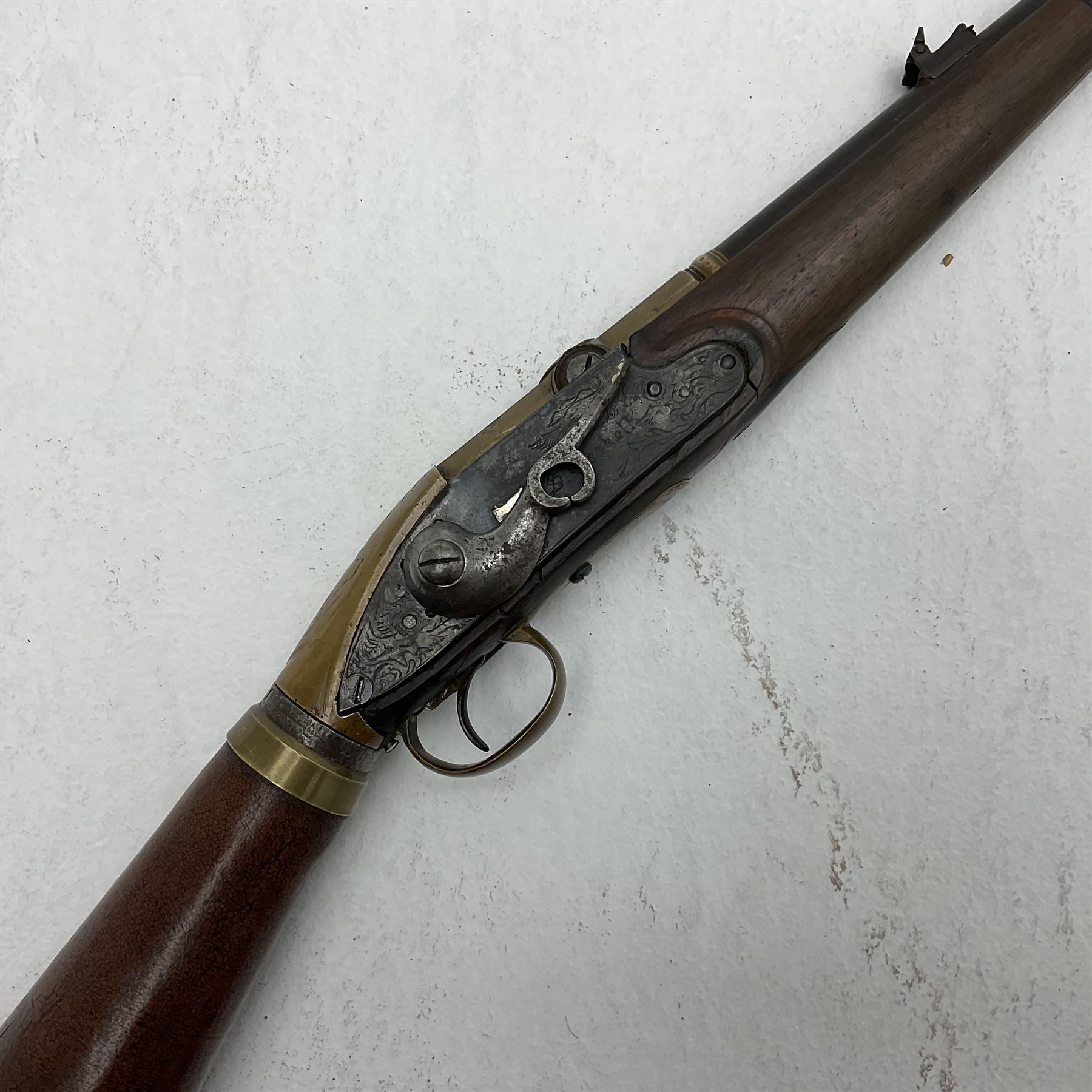 Late 18th century 7.2mm (approx. .28 calibre) Girandoni system single shot reservoir air rifle, the 62cm steel barrel with swivelling two-leaf rear sight, brass breech decorated with a sunburst and lever opening top loading, engraved steel lock-plates marked 'S. Gaskell' to the right side underneath the cocking lever, brass trigger guard,  leather covered steel butt reservoir of tapering conical form with brass ferrule and walnut fore-stock with horn mounts L107cm overall