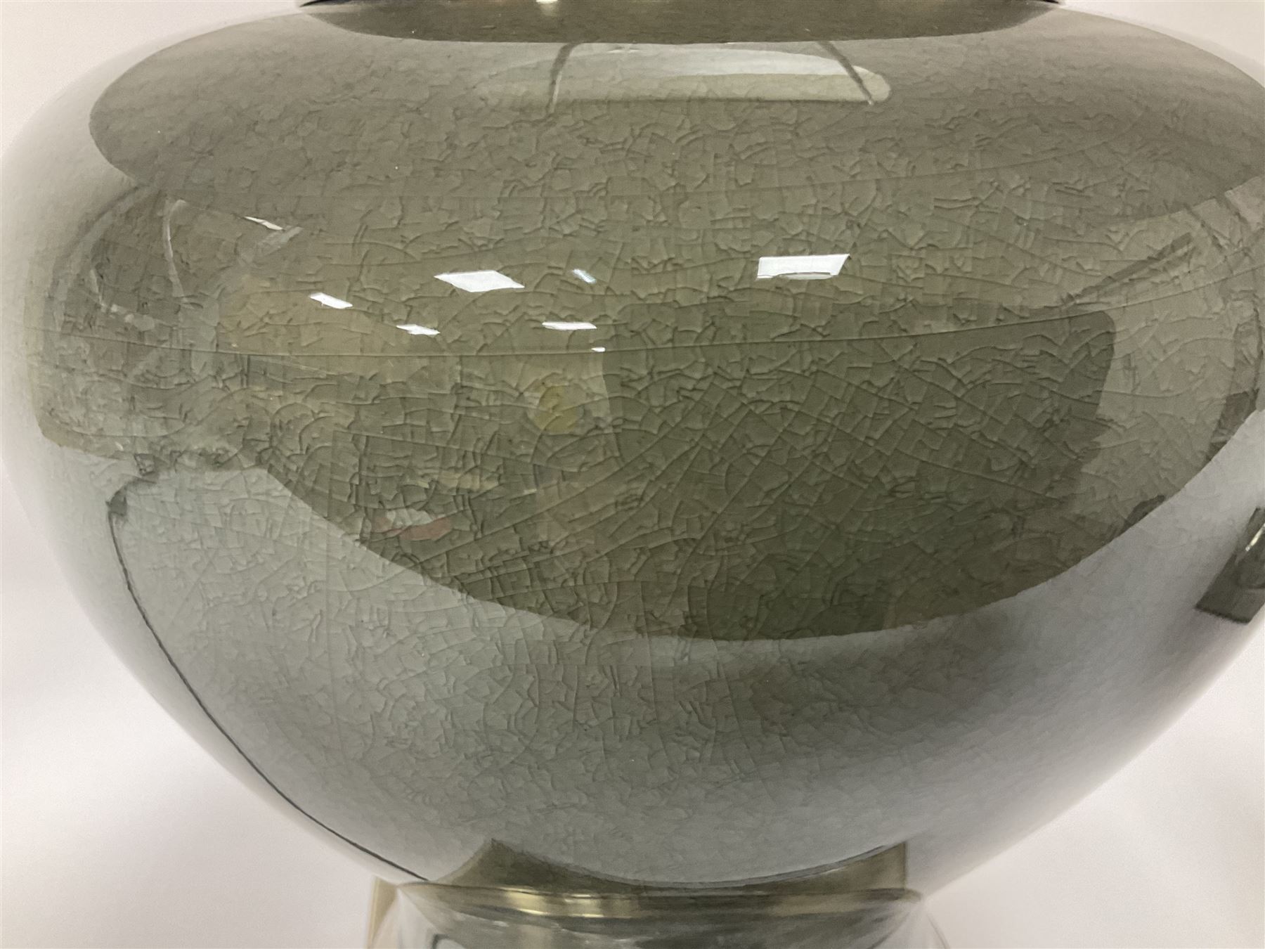 Pair of table lamps of squat baluster form, with a crackle glaze to a dark grey ground, upon a square base, including shade H57cm