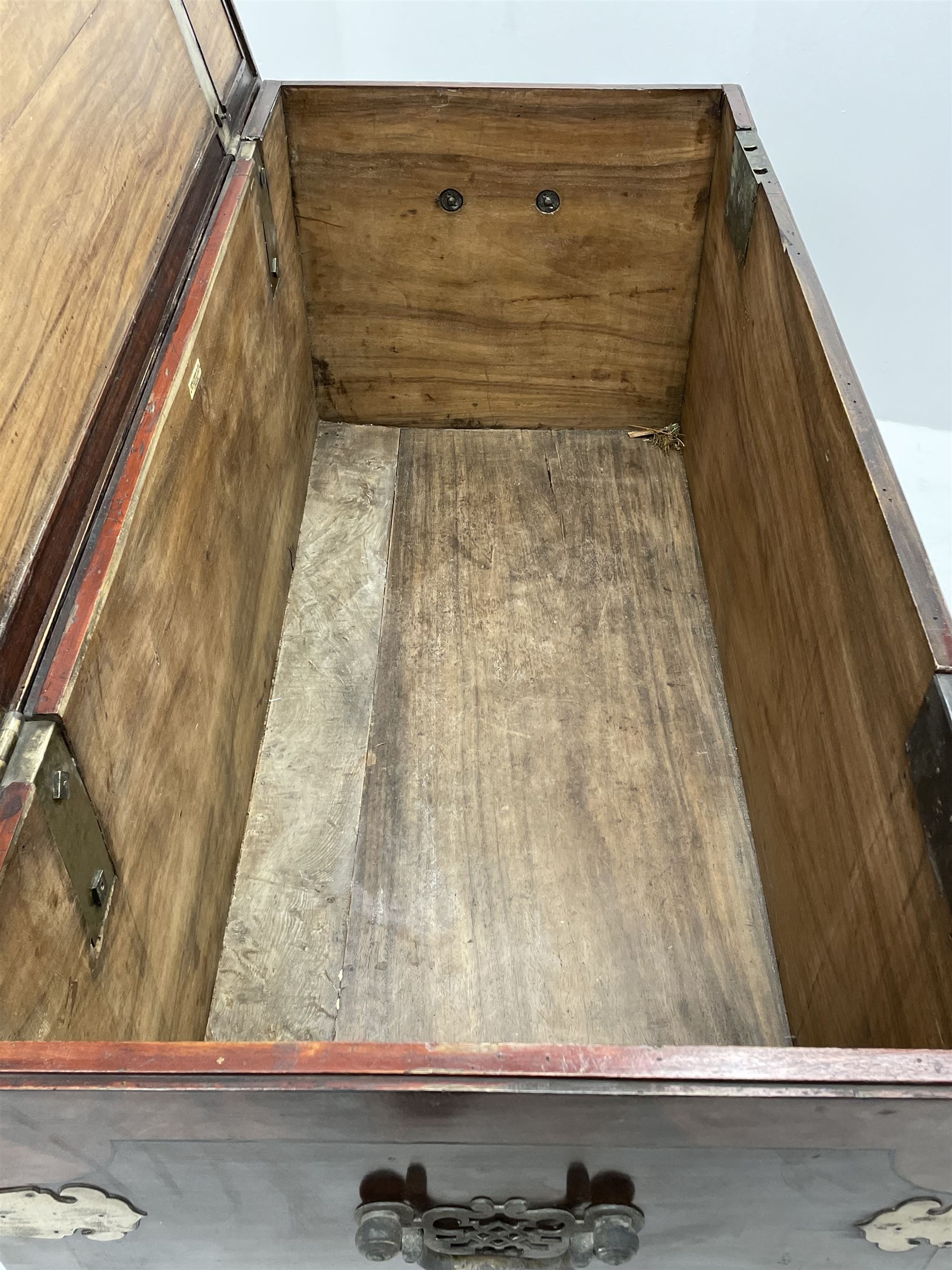 19th century camphor wood and mahogany silver chest, the hinged banded top with circular brass mounts which secure the interior strap hinges, fretwork metal strapping to the corners, on stand with plain frieze and acanthus carved cabriole ball and claw feet