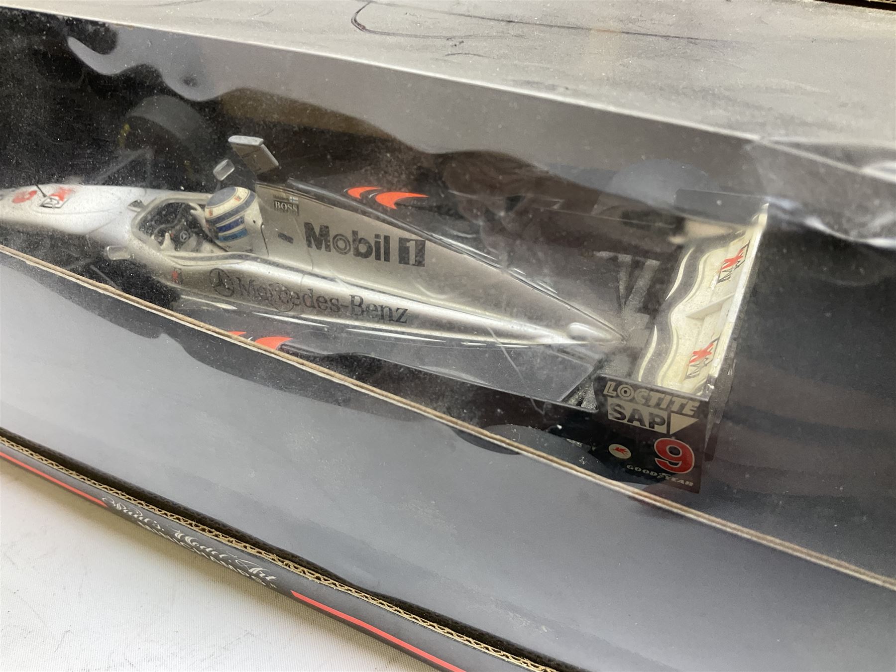 Two Collezione Classico large scale die-cast models of a Ferrari 1972 312P with Racing Fuel Pump and Ferrari 1958 250 Testa Rossa with Road Fuel Pump; and two Minichamps 1:18 scale models of a McLaren Mercedes Racing Car and Auto Union Typ C racing car; all boxed (4)