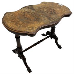 Victorian figured walnut stretcher table, shaped moulded top with quarter matched veneers inlaid with boxwood stringing and trailing foliate, on twin turned pillar supports united by turned stretcher, on acanthus carved splayed supports 