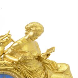 French- Napoleon III porcelain inset 8-day figural clock in a gilt case c1870, drum housed movement resting on a rectangular plinth with light blue porcelain panels each painted with different classical images and depictions from antiquity, conforming dial with a garland of flowers to the centre, gilt Roman numerals, minute track and brass spade hands, with a seated figure of a classical maiden reading a book, mounted on a matching gesso base with a velvet padded top, Parisian countwheel striking twin train movement, striking the hours and half hours on a bell. With a contemporary ebonised base and oval glass dome. With pendulum.
