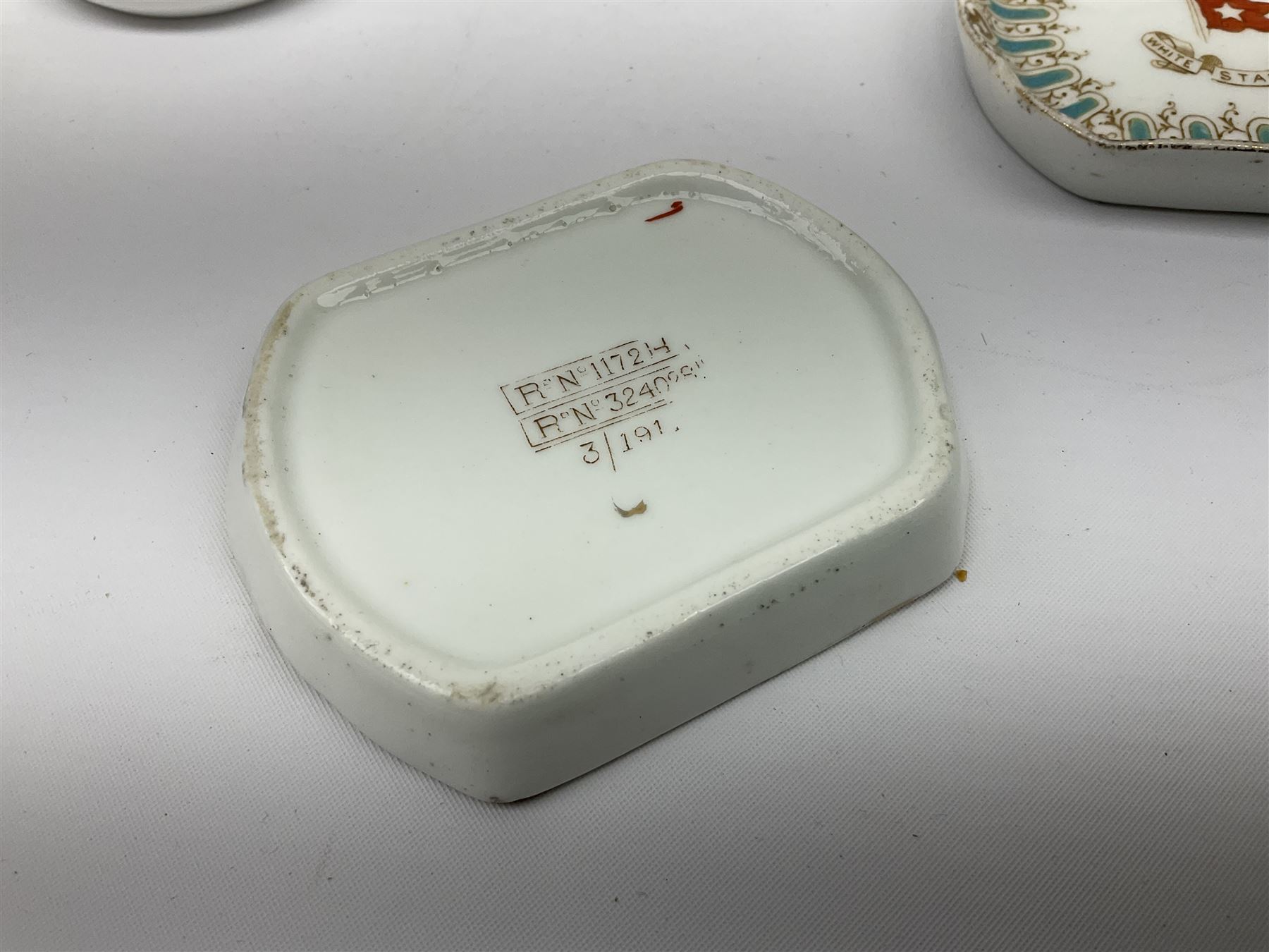 White Star Line, six pieces of porcelain by Stonier & Co. Liverpool, comprising four tea cups, three saucers, jug and three pin trays, registered design no. 117214/324028, printed mark beneath 