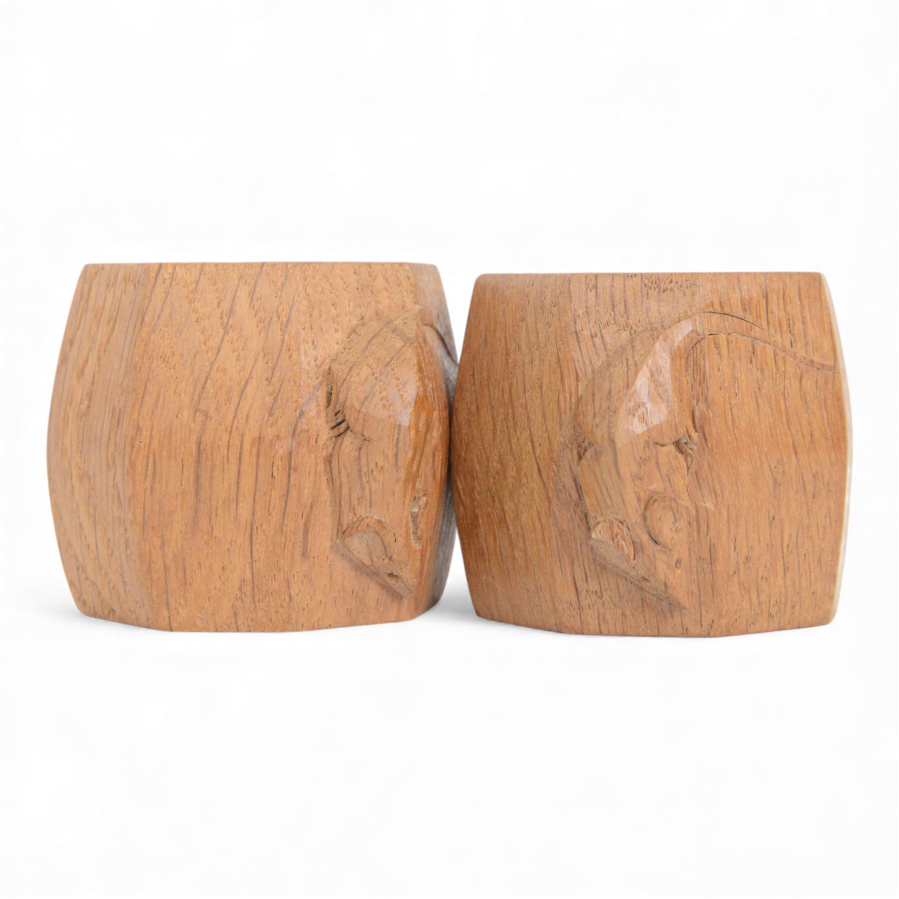 Mouseman - pair of oak napkin rings, of bulbous octagonal form, with carved mouse signature, by the workshop of Robert Thompson, Kilburn, W4.5cm