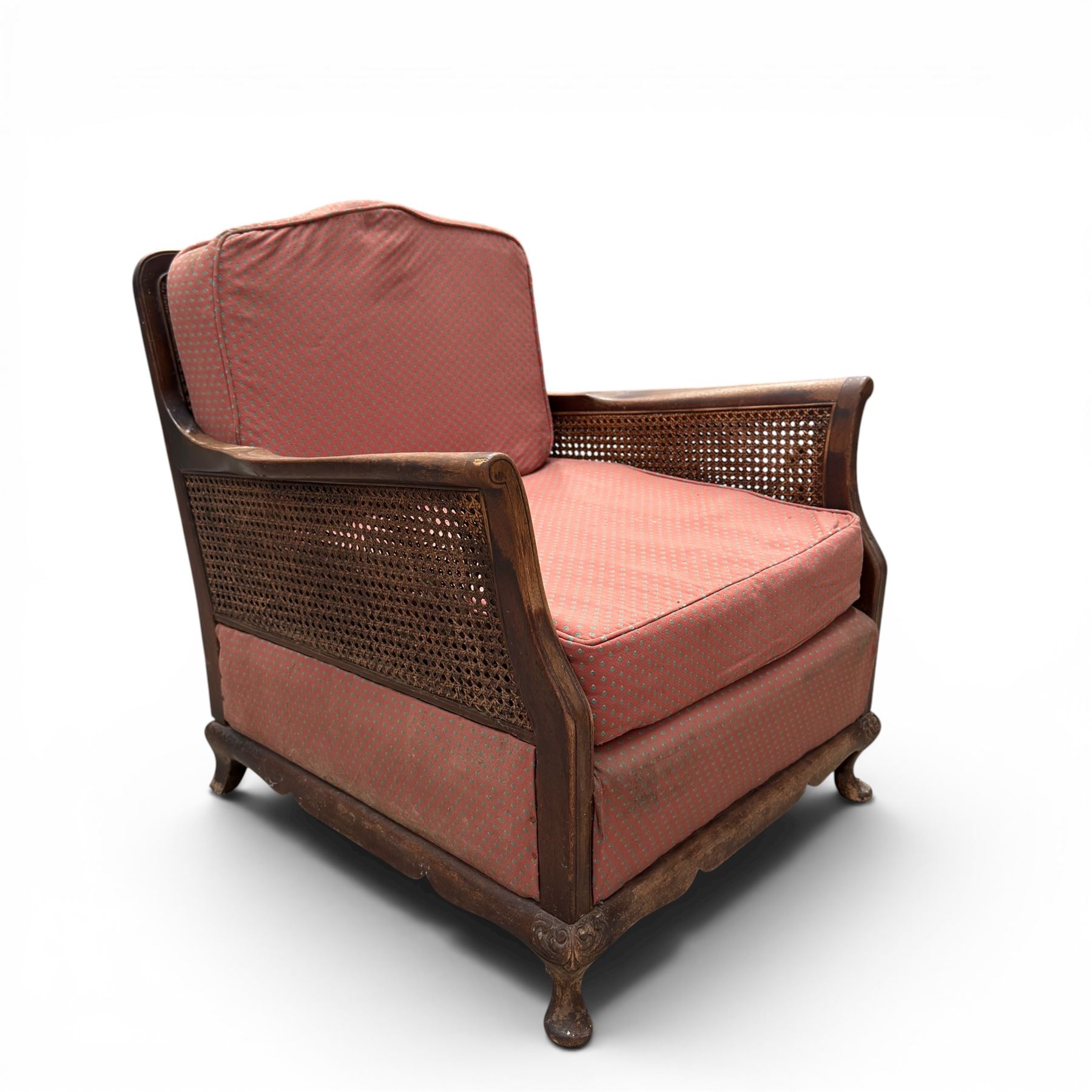 Early 20th century French style bergère conservatory suite, canework back and sides with red upholstered loose seat cushions, on cabriole feet