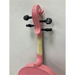 Zest full size pink violin, with a solid wood body and maple head, with matching pink bow and two further bows, in a hard case Length 60cm