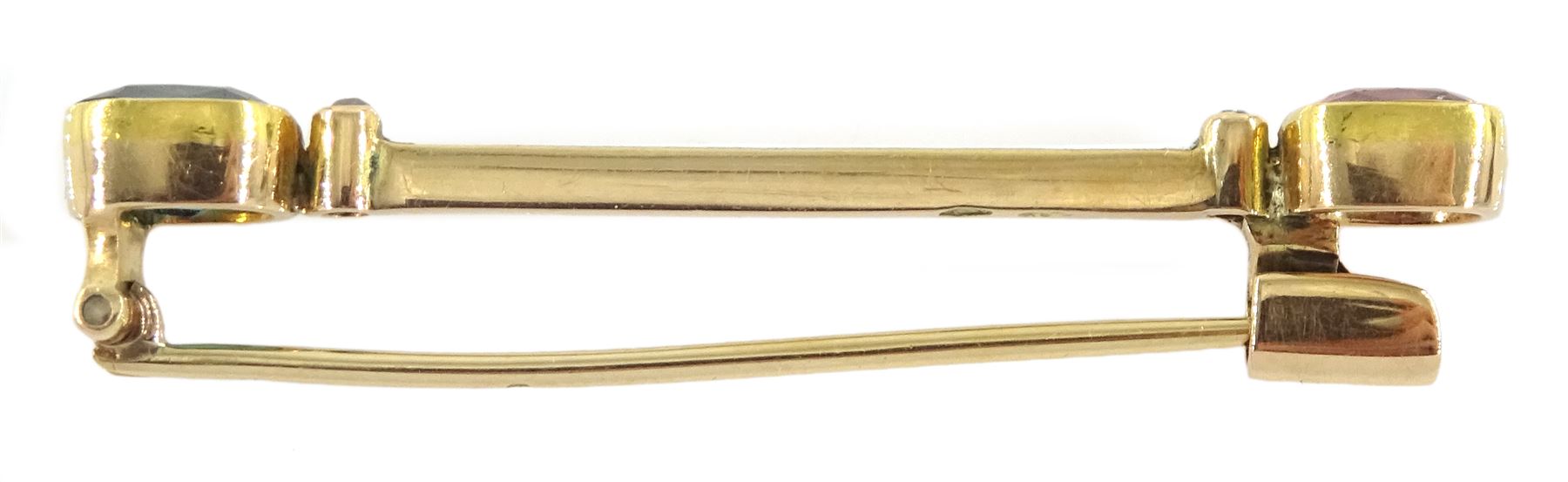 Early 20th century Austrian 14ct gold tourmaline, diamond and white enamel bar brooch, each end set with a green and pink tourmaline and a single stone diamond chip, by Ernst Paltscho (Vienna 1858-1929) hallmarked, in original fitted silk lined box 
