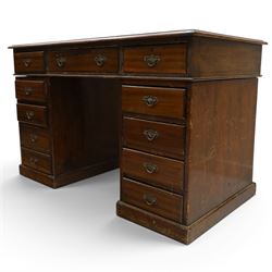 Late 19th century twin-pedestal desk, red leather inset top over an assortment of eleven drawers, on plinth base (W126cm D65cm H77cm); with Edwardian oak framed Captains swivel desk chair, of tub shaped form with spindle back supports (W60cm H89cm)