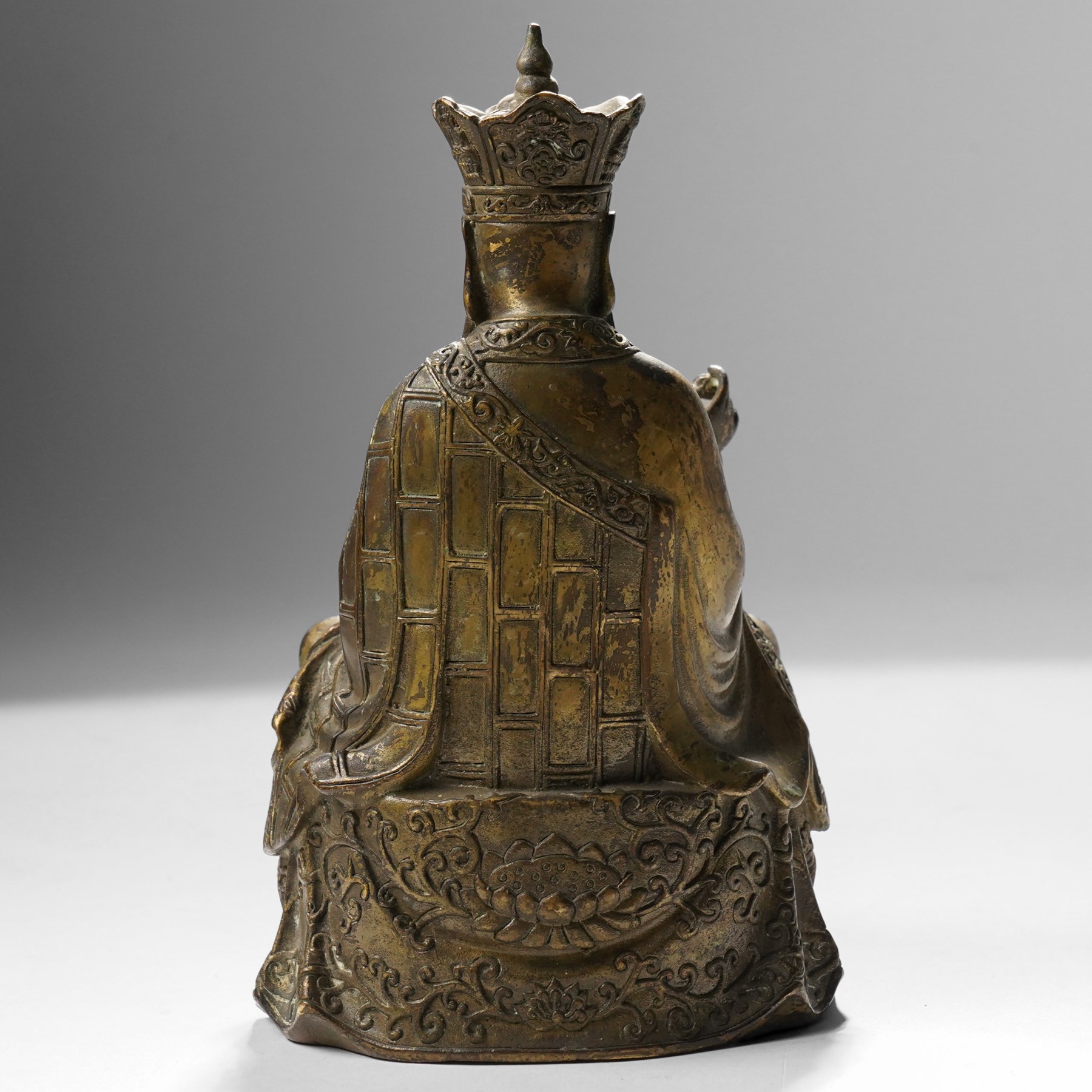 Chinese cast bronze figure of Ksitigarbha, wearing a five-pointed crown and monastic robes, H19.5cm