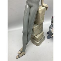 Four Lladro figures, comprising Touch of Class no 5377, Boy Student no 4517, Ocean Beauty no 5785 and Carnival Couple no 4882, largest example H45cm