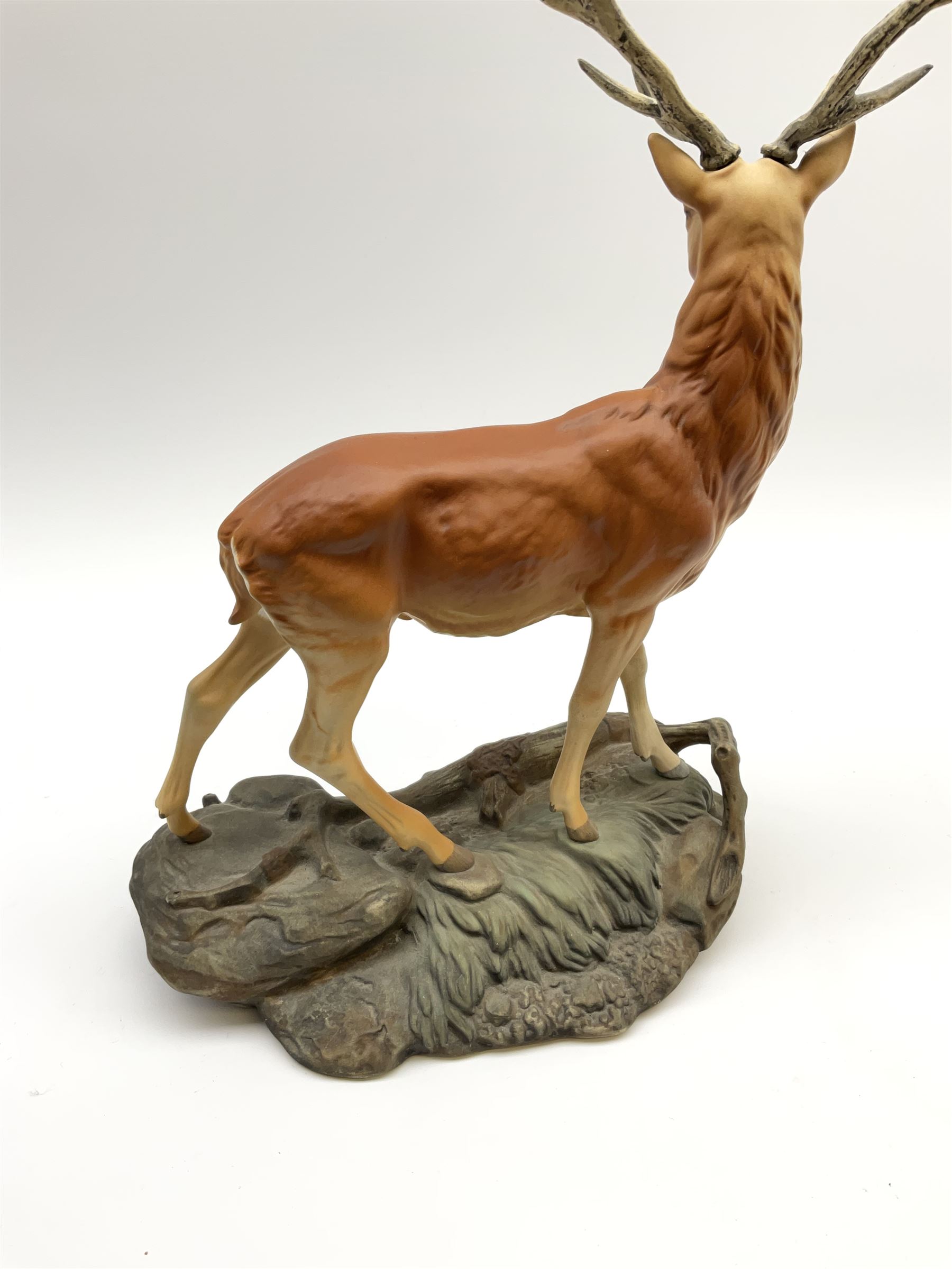 A Beswick Connoisseur matt model of a Stag upon a rocky modelled base, 2629