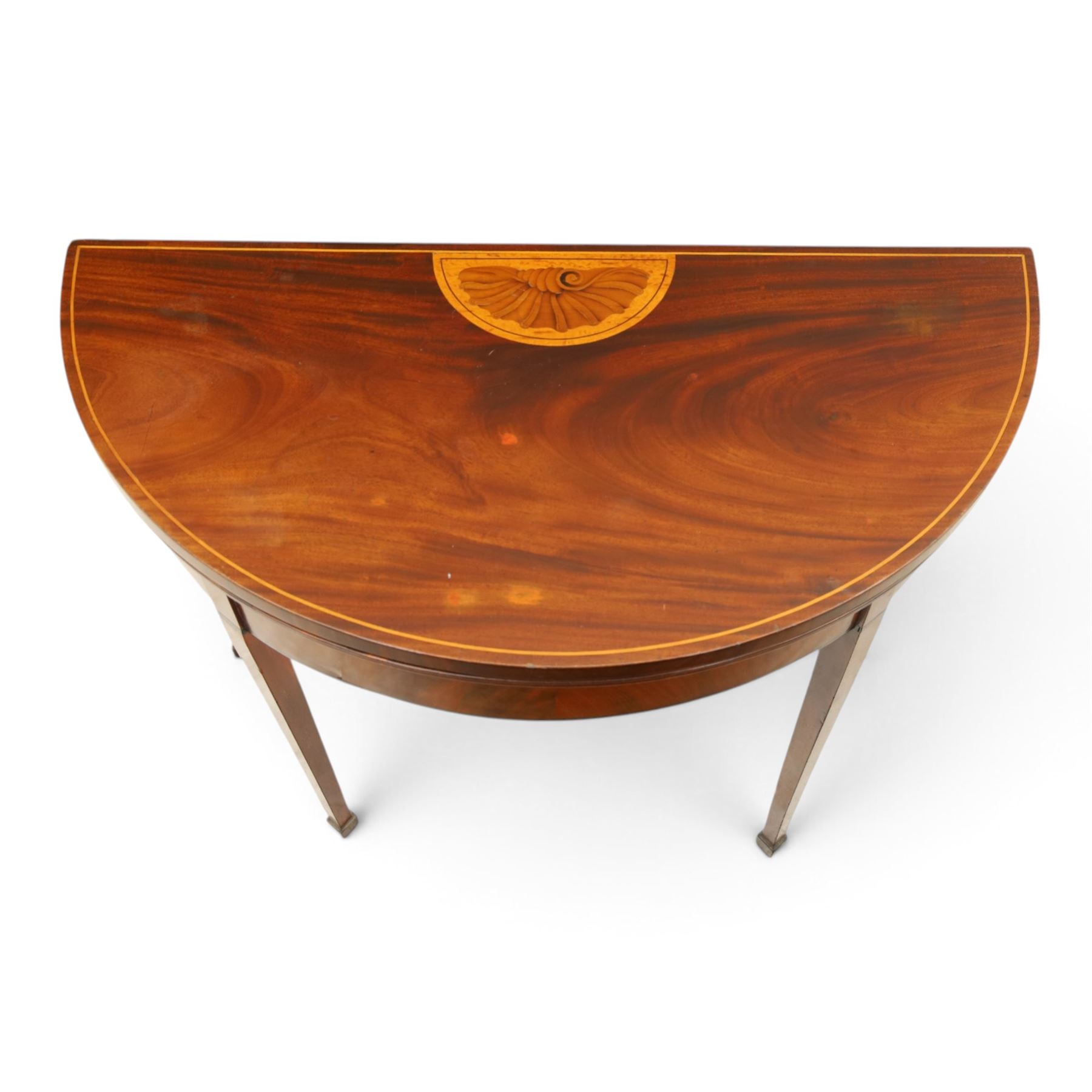 Edwardian mahogany inlaid demi-lune side table, inlaid top with shell motif, green baize interior, with gateleg, raised on square tapering supports terminating in spade feet