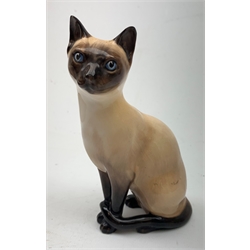 A large Sylvac figure of a Terrier dog No 1380, H28cm, together with a large Sylvac figure of a Rabbit No 1027, and a Sylvac figure of a bear cup, a  Royal Doulton figure of a cat No 1867, a further Royal Doulton figure of a cat HN2655, a Whyte & Mackay Eagle decanter, and a large figure of a Leopard cub. 