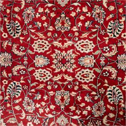 Persian crimson ground rug, interlacing floral stems linking ivory palmettes, rosettes and serrated leaves, within a navy floral border flanked by ivory patterned guards