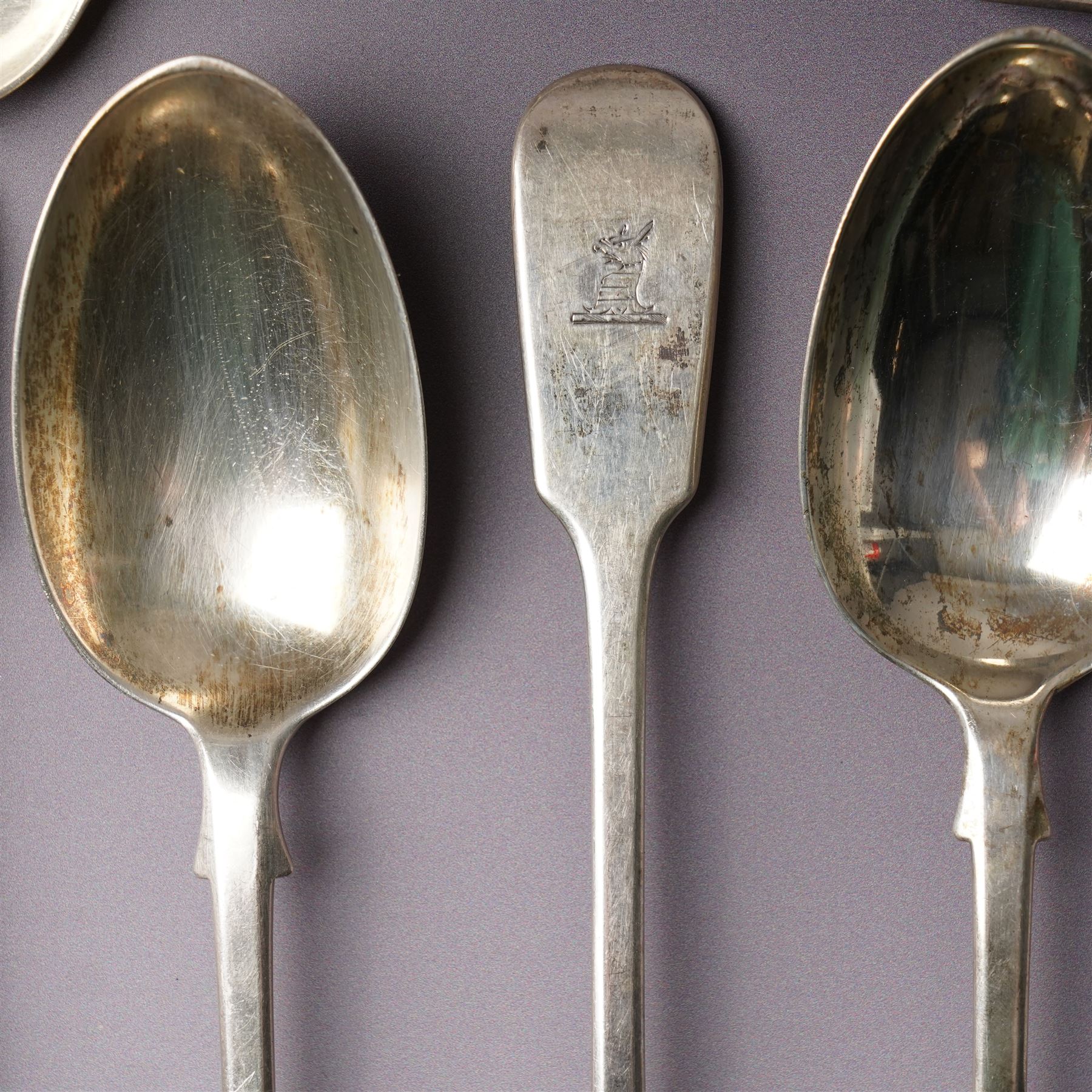 Silver Fiddle pattern canteen, composite, largely Victorian, comprising twelve table spoons, twelve table forks, twelve dessert spoons, eleven dessert forks, one soup ladle, one sauce ladle, and one serving spoon, each terminal engraved with The Everitt family Griffin crest, largely hallmarked Francis Higgins III, London 1892, soup and sauce ladle dated 1808 and 1828 

Provenance: From the collection of Andrew Chichester Everitt.



