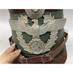 WW2 German rural police shako with helmet plate and liner; bears label 'Hans Romer Echt Fiber-Tschako Neu-Ulm (Donau)'