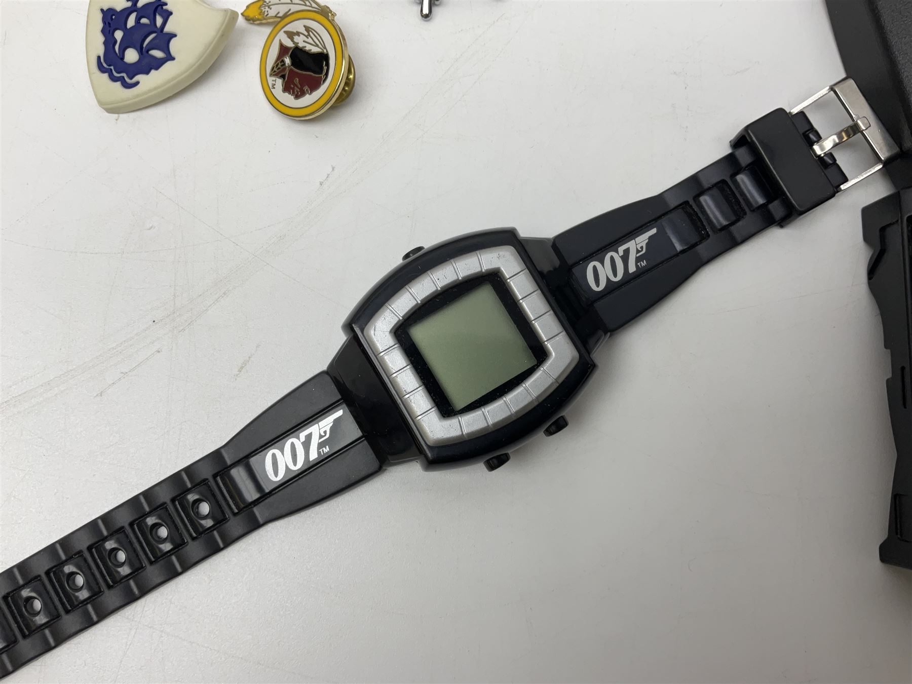 Three Sekonda wristwatches, together with other wristwatches, enamel badges and collectable badges