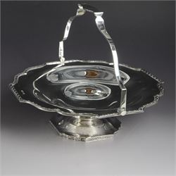1920s silver swing handled pedestal dish, of octagonal form with shaped rim and foliate bo...